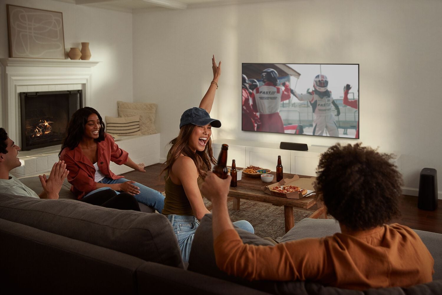 Woman excited watching sports with sound bar